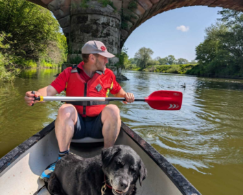 Man and his dog in a canoe on the River Severn - Hire A Canoe