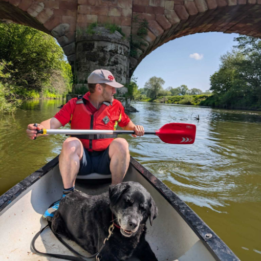 Man and his dog in a canoe on the River Severn - Hire A Canoe