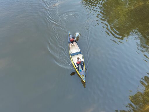 Yellow Canadian open canoe from above on a river