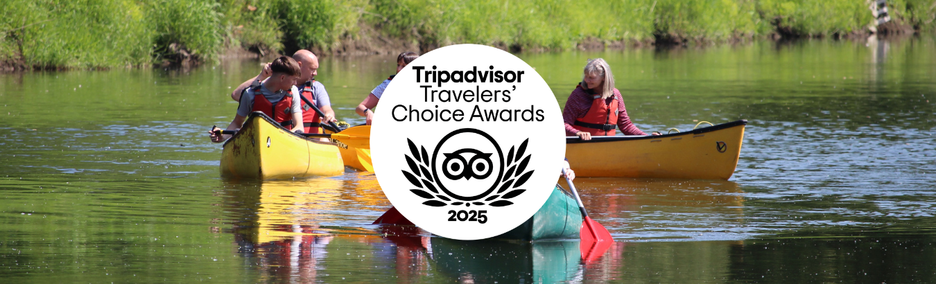 photo of the river severn with canoes on it. An overlay of the tripadvisor travelers' choice award 2025 logo in white and black